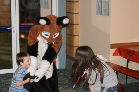 Kid playing with Eos and Fursuiter